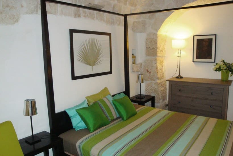 A bedroom in masseria Settarte in Cisternino